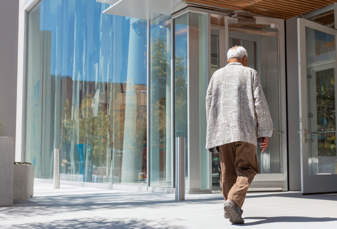 Senior walking into a building
