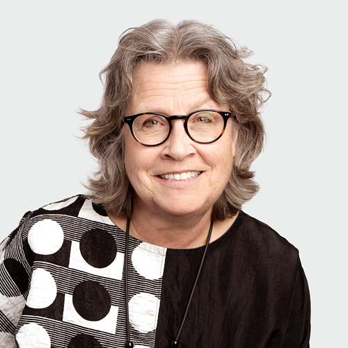 Woman with glasses and a abstract black and white blouse