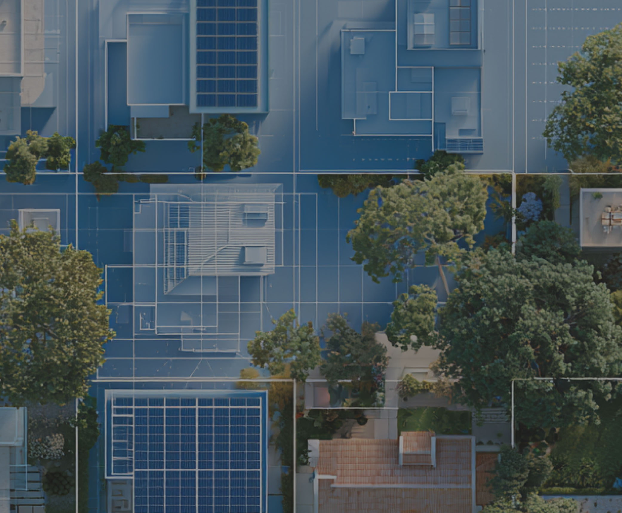 Aerial view of a blue-toned urban building complex with grid-like windows and surrounding trees in a cityscape